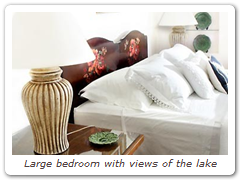 Large bedroom with views of the lake